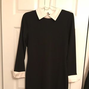 Black and white dress with a zipper on the back.